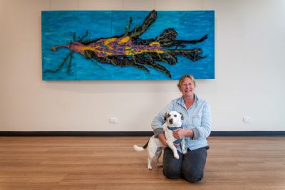 Artist Deb Cobern with Gus and her artwork 'Leafy Sea Dragon'